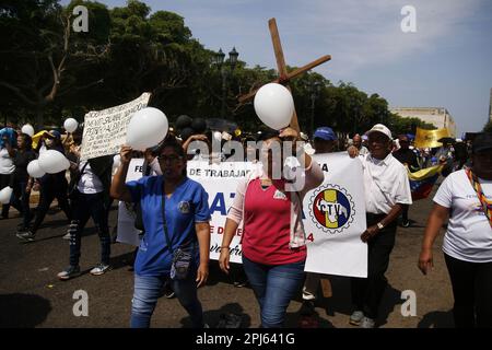 Maracaibo, Venezuela. 30th Mar, 2023. Teachers, pensioners, the health sector and retirees march in protest to the State Governor's Office demanding better wages in Maracaibo, Venezuela, on March 30, 2023.More than 8 regional Unions participated in the demonstration, called “Worker's Via Crucis” as a prelude to the Easter holiday. (Photo by Humberto Matheus/Sipa USA) Credit: Sipa USA/Alamy Live News Stock Photo