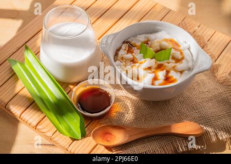 Porridge in a serving bowl. Marrow porridge is a kind of food in the form of white porridge made from rice flour. Authentic Indonesian food Stock Photo