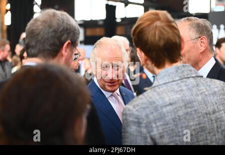 Hamburg, Germany. 31st Mar, 2023. King Charles III of Great Britain (M) speaks with guests during the ceremonial reception hosted by the British Embassy at Schuppen 52. The reception marks the end of a three-day visit to Germany by the British king and his wife. Credit: Jonas Walzberg/dpa/Alamy Live News Stock Photo