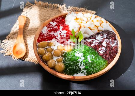 Pearl porridge or pearl sago. Popular Indonesian desserts served on wooden plates with various flavours Stock Photo