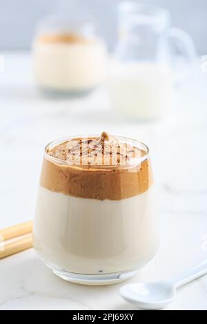 Dalgona coffee. Iced fluffy creamy whipped trend drink with coffee foam and milk Stock Photo