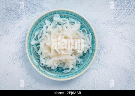 Shirataki noodles - gelatinous traditional Japanese noodles made from the konjac yam, carbohydrate and gluten free alternative Stock Photo