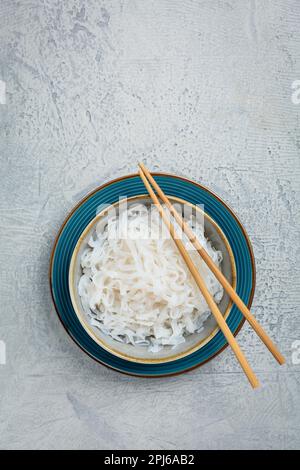 Shirataki noodles - gelatinous traditional Japanese noodles made from the konjac yam, carbohydrate and gluten free alternative Stock Photo