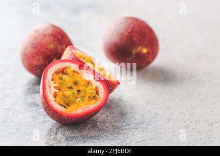 Organic raw passion fruit on kitchen table Stock Photo