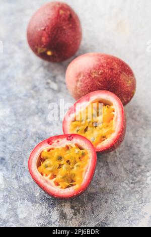 Organic raw passion fruit on kitchen table Stock Photo
