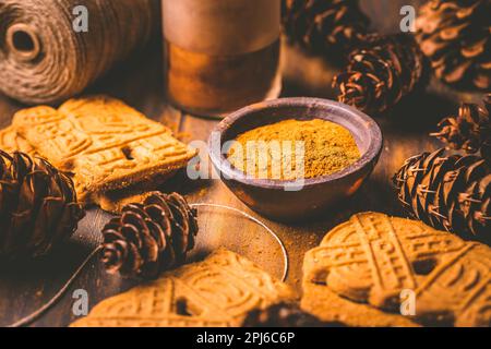 Gingerbread spice mix and seasoning for gingerbread cookies for Christmas on wooden background Stock Photo