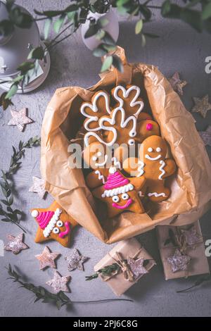 Gingerbread cookies for Christmas in cookie box with stars and small presents Stock Photo