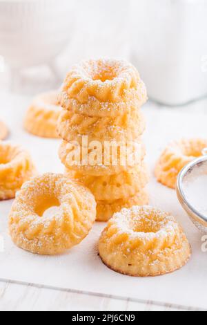 Small sponge cakes with cottage cheese. Ring cakes on white background Stock Photo
