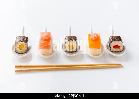 Assortment of vegan sushi with vegetables, seitan, Konjac plant, tofu as fish substitudes, with finger lime as caviar. Vegan food concept Stock Photo