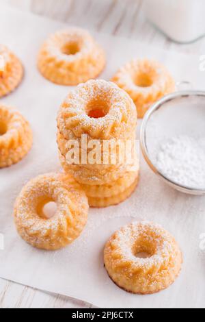 Small sponge cakes with cottage cheese. Ring cakes on white background Stock Photo
