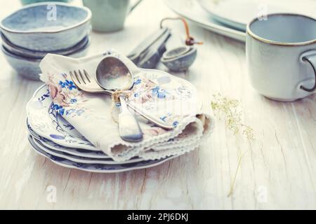Sustainability concept - stoneware and kitchenware on wooden kitchen table Stock Photo