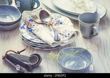 Sustainability concept - stoneware and kitchenware on wooden kitchen table Stock Photo