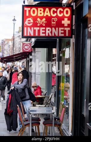 Sign for tobacco, vape and internet outside a small shop on 27th March 2023 in London, United Kingdom. Despite fewer people smoking, it remains the leading cause of preventable death and disease in the UK. Stock Photo