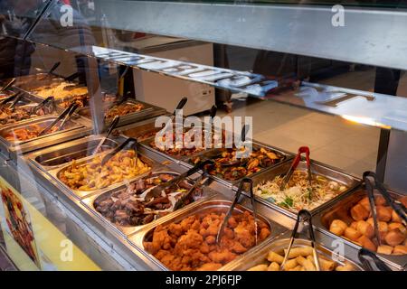 Eat as much as you like hot buffet at a Chinese restaurant in Chinatown on 27th March 2023 in London, United Kingdom. Many people eat bargain food responsibly and it provides great value for consumers, however concerns over obesity levels in the UK remain, especially with foods containing high levels of fat and sugar. Obesity is a medical condition in which excess body fat has accumulated to the extent that it may have a negative effect on health. Stock Photo