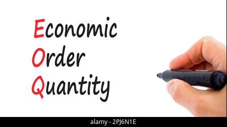 EOQ economic order quantity symbol. Concept words EOQ economic order quantity on paper on a beautiful white background. Businessman hand. Business EOQ Stock Photo