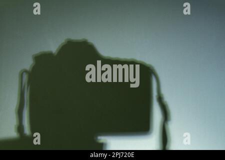 shadow camera on a tripod in a room Stock Photo