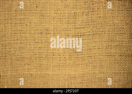 light beige burlap background in daylight close up Stock Photo