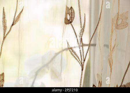 curtains with embroidered flowers as a background Stock Photo