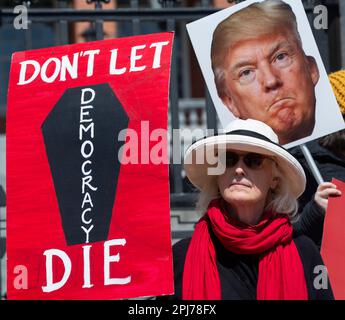 Trump Indictment: 31 March 2023, Boston, MA, USA: A small group of middle-age supporters of the prosecution of former U.S. President Donald Trump gathered on the steps of the Massachusetts State House in central Boston at noon on Friday. Credit: Chuck Nacke/Alamy Live News Stock Photo