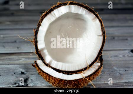 Coconut fruit cocoanut (Cocos nucifera) of the palm tree family (Arecaceae), genus Cocos, botanically is a drupe, not a nut, provides food, fuel, cosm Stock Photo