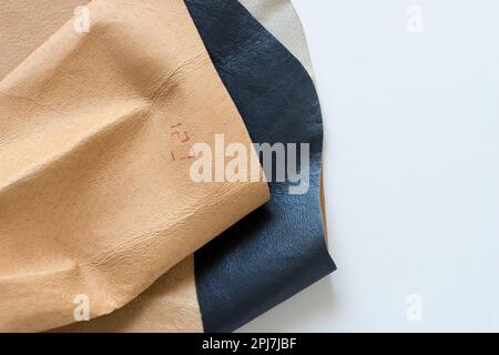 leather sample with stamp marking folded on paper Stock Photo