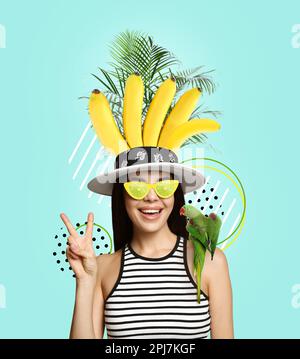 Happy woman with parrot on color background. Summer party concept. Stylish creative design Stock Photo