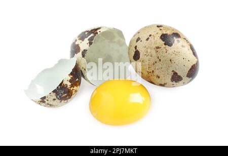 Whole and cracked quail eggs on white background Stock Photo