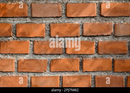 Texture of red brick wall as background, closeup view Stock Photo