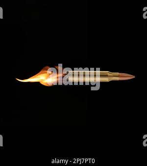 Bullet with flames flying on black background Stock Photo