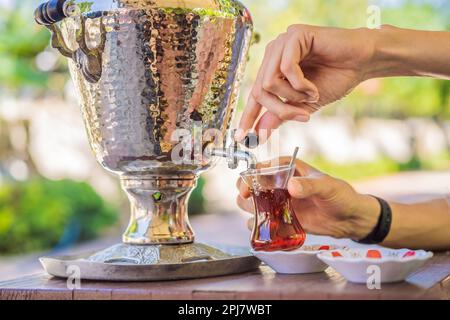 Traditional Turkish Tea with Turkish tea cup and copper tea pot
