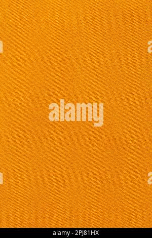 Vertical Orange color fabric texture as background. Stock Photo