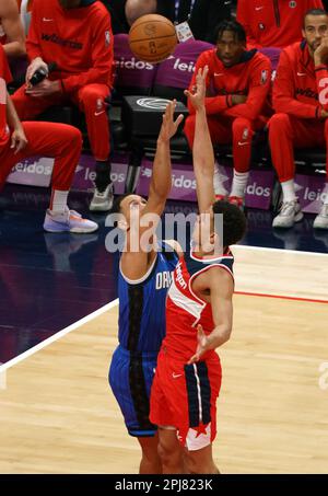 Washington, USA. 31st Mar, 2023. WASHINGTON, DC - MARCH 31: Orlando Magic guard Jalen Suggs (4) and Washington Wizards guard Johnny Davis (1) go for a rebound during a NBA game between the Washington Wizards and the Orlando Magic, on March 31, 2023, at Capital One Arena, in Washington, DC. (Photo by Tony Quinn/SipaUSA) Credit: Sipa USA/Alamy Live News Stock Photo