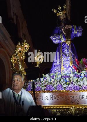 Devotees carrying a religious image leading the Friday of Sorrows ...