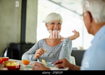 Breakfast is the most important meal of the day. a senior couple having breakfast at home. Stock Photo