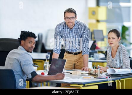 Their decisions ensure success. Portrait of a diverse group of designers working together in an office. Stock Photo
