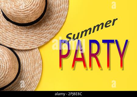 Stylish hats on yellow background, flat lay. Summer Party Stock Photo
