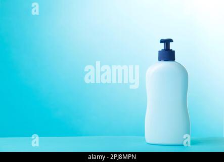 Blue tube of cosmetic on blue background, cut out Stock Photo