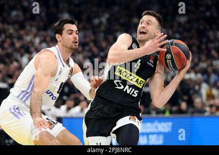 Belgrade. 31st Mar, 2023. Partizan's Aleksa Avramovic (R) vies with Real Madrid's Alberto Abalde during the regular season round 32 Euroleague basketball match between Partizan and Real Madrid in Belgrade, Serbia on March 31, 2023. Credit: Predrag Milosavljevic/Xinhua/Alamy Live News Stock Photo