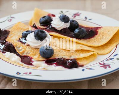 Blueberry crepes with soy whipped cream Stock Photo