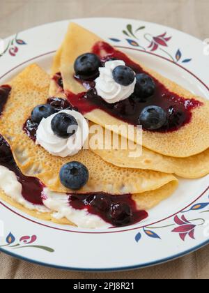 Blueberry crepes with soy whipped cream Stock Photo