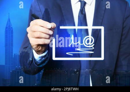Electronic signature concept. Double exposure of businessman with pen near virtual screen and cityscape