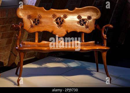 Chair designed by Antoni Gaudí for the Casa Calvet and exhibited in an exhibition inside Casa Milà - La Pedrera (Barcelona, Catalonia, Spain) Stock Photo