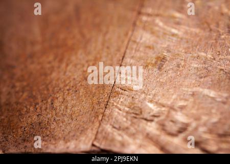 Extreme closeup of crumpled brass foil texture. Selective soft focus, shallow depth of field. Stock Photo