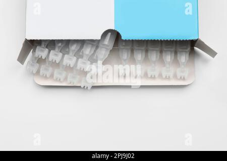 Package with single dose ampoules of sterile isotonic sea water solution on white background, top view. Space for text Stock Photo