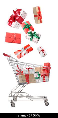 Beautifully wrapped gift boxes falling into metal shopping cart on white background Stock Photo