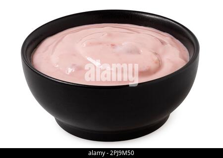 Strawberry yogurt in a black ceramic bowl isolated on white. Stock Photo