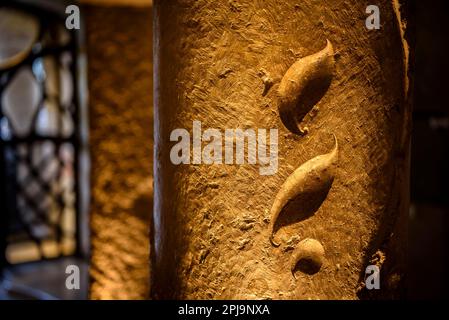 Shapes of leaves sculpted on a stone column on the access staircase to the noble floor of La Pedrera - Casa Milà (Barcelona, Catalonia, Spain) Stock Photo