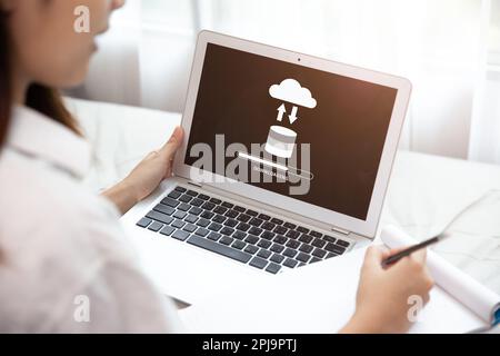 People using Cloud Drive Technology Download or Upload Load Save Files from Internet Cloud Storage System Stock Photo