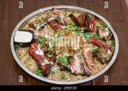 tandoori chicken and kebab served in steel plate at night Stock Photo