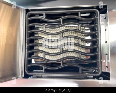 Stainless steel gas grill grates. Modern gas grill. Close-up.. Stock Photo